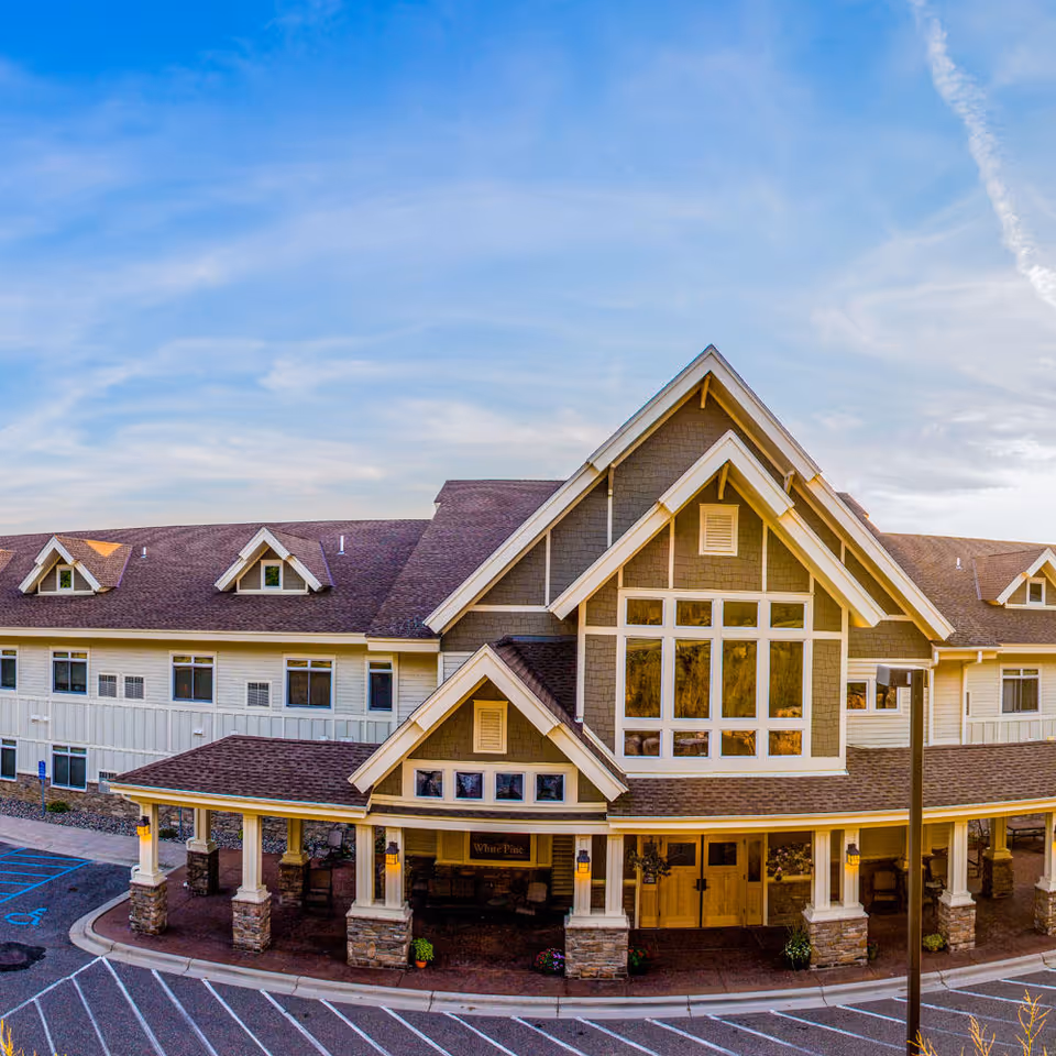 Exterior view of Cottage Grove White Pine senior living facility entrance.