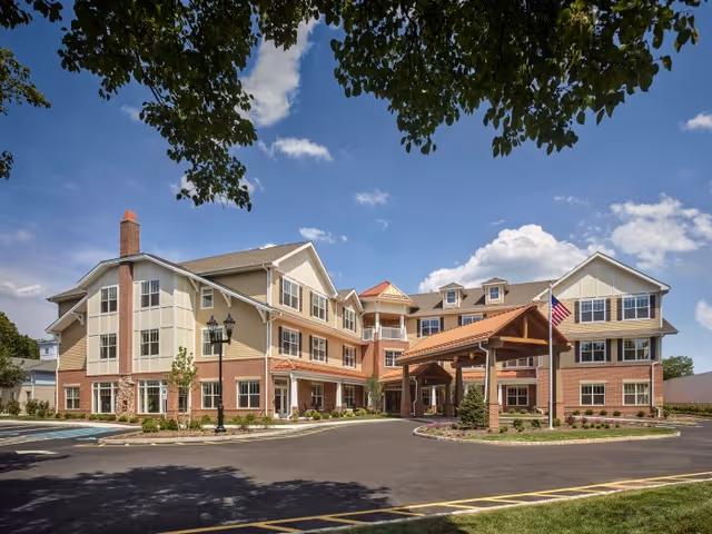 Exterior view of Arbor Terrace Morris Plains showing the entrance and covered drop-off area.