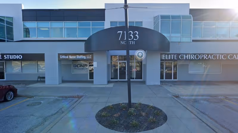 Exterior view of CNS Cares storefront with signage and parking lot