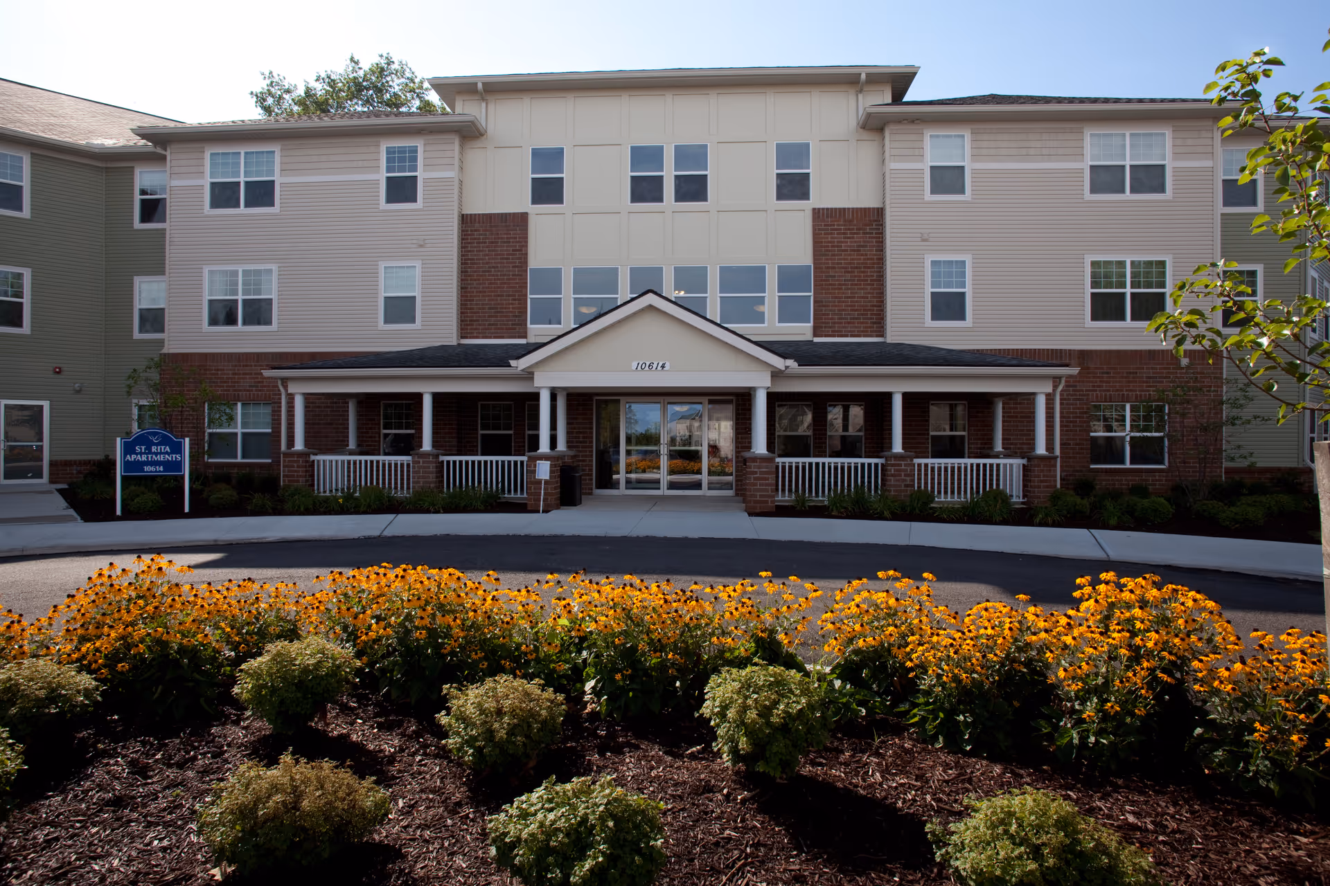 Front view of Jennings Assisted Living building with entrance and landscaping.