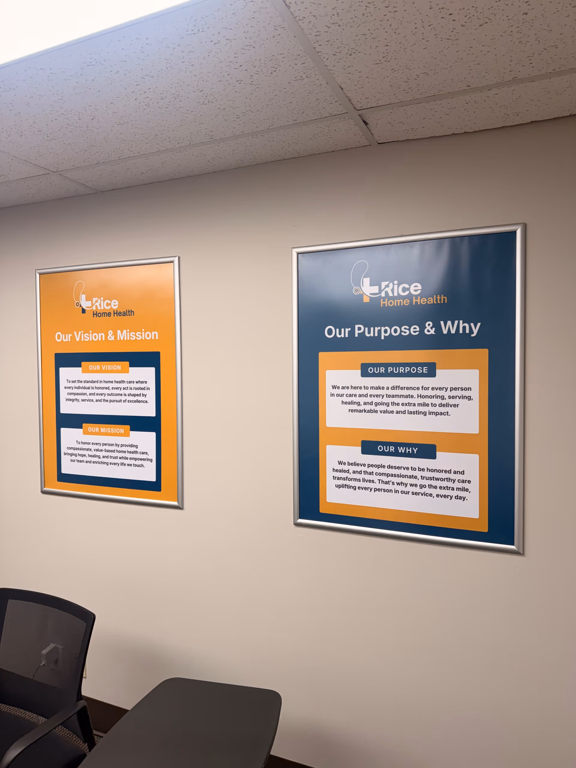 Two framed posters on a beige hallway wall at Rice Home Health.