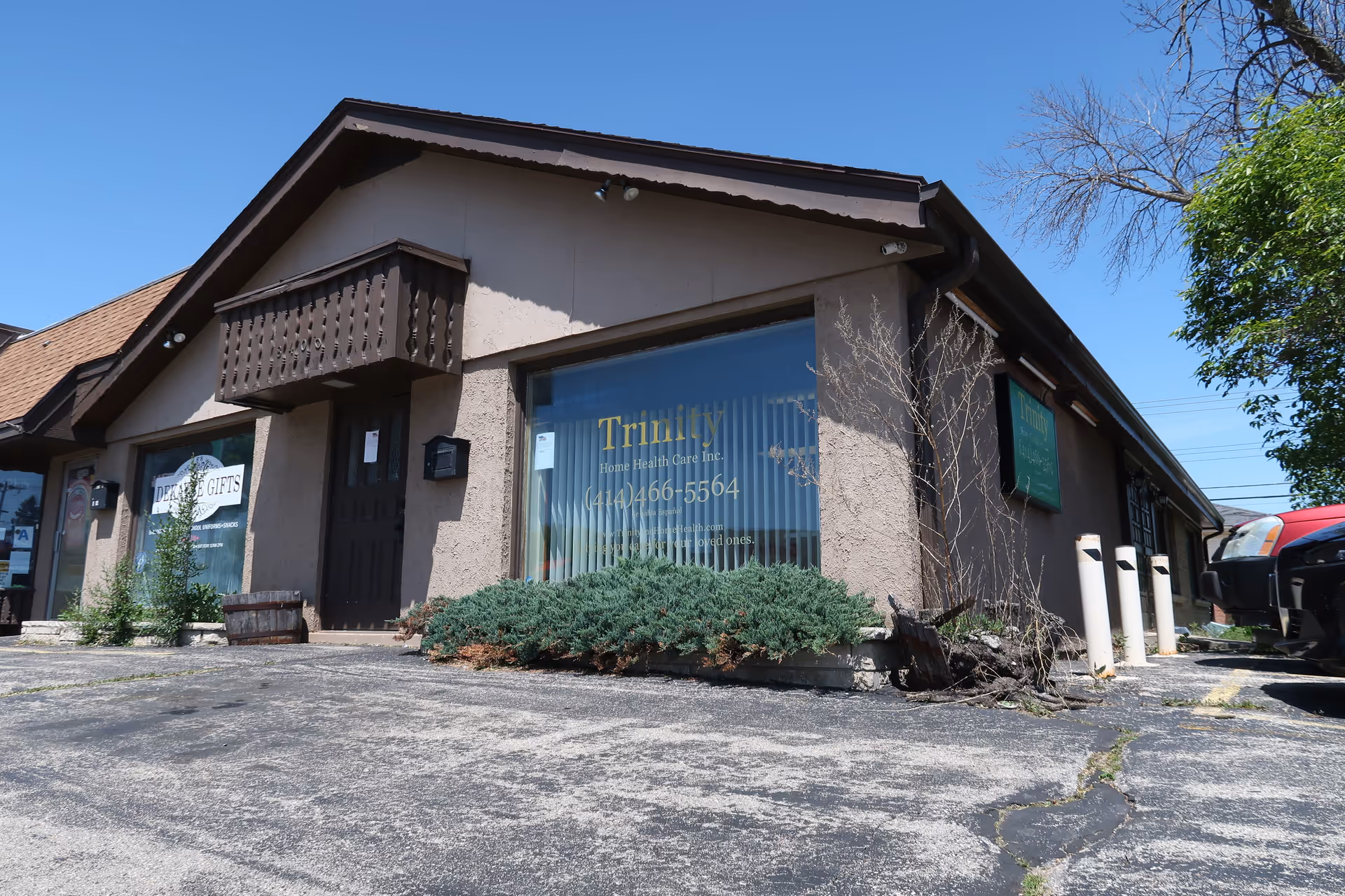 Exterior view of a single-story beige building with Trinity Home Health Care signage