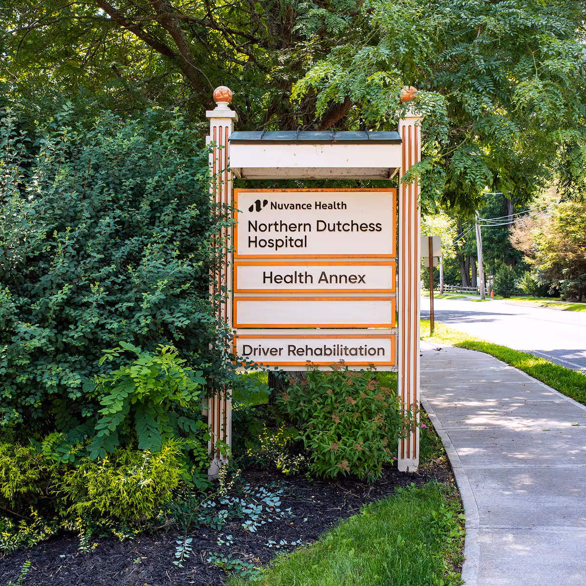 Outdoor sign for Nuvance Health Northern Dutchess Hospital Health Annex with surrounding greenery