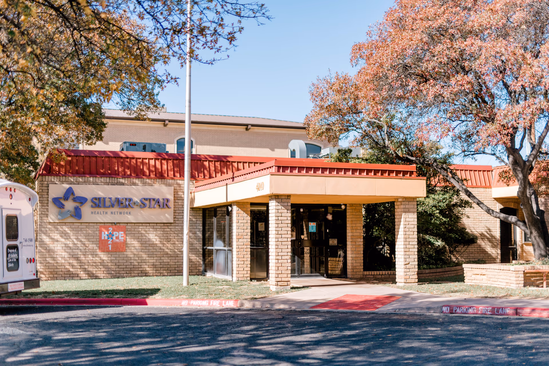 Exterior view of Silver Star Health Network building with entrance canopies and trees