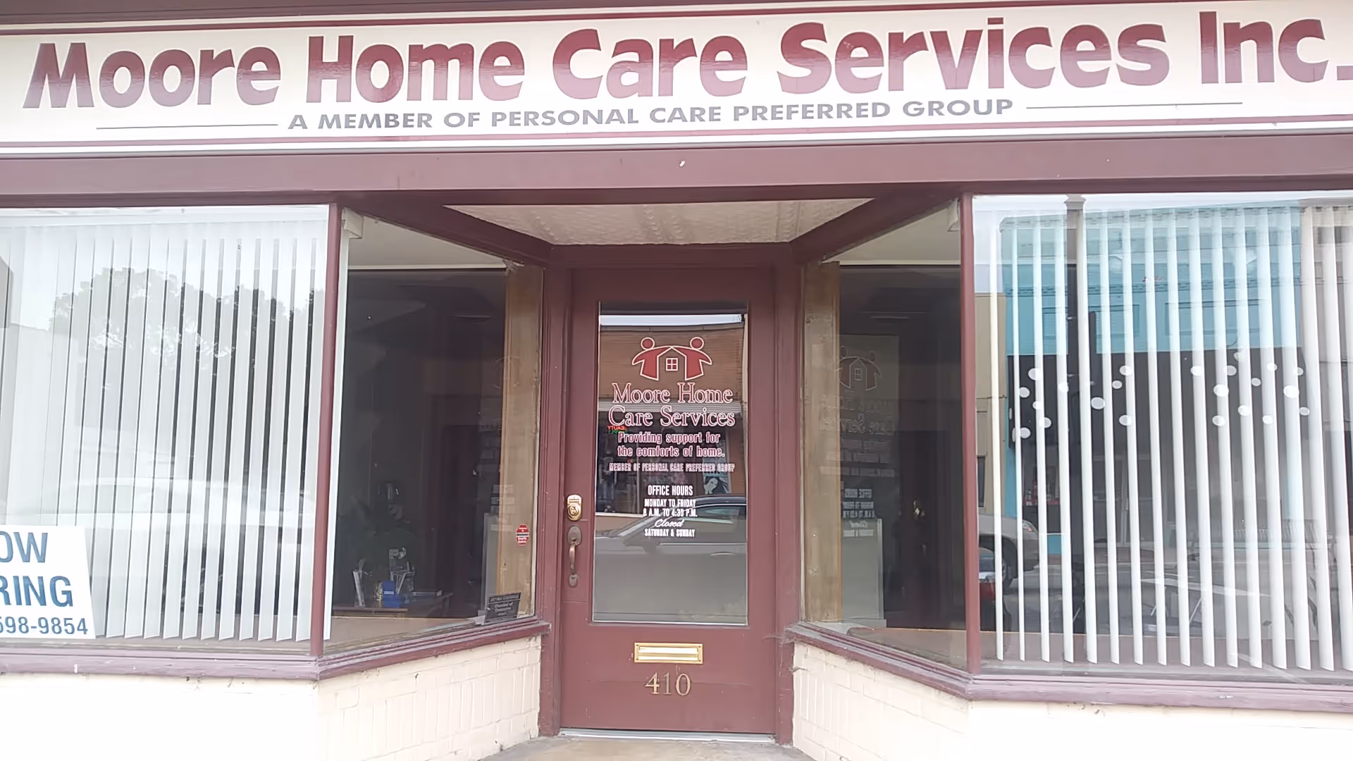 Storefront of Moore Home Care Services Inc with glass doors and large display windows.