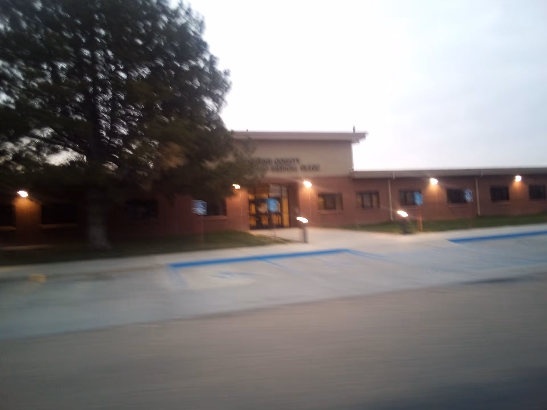 Exterior view of Stevens County Hospital entry with brick facade and surrounding parking.
