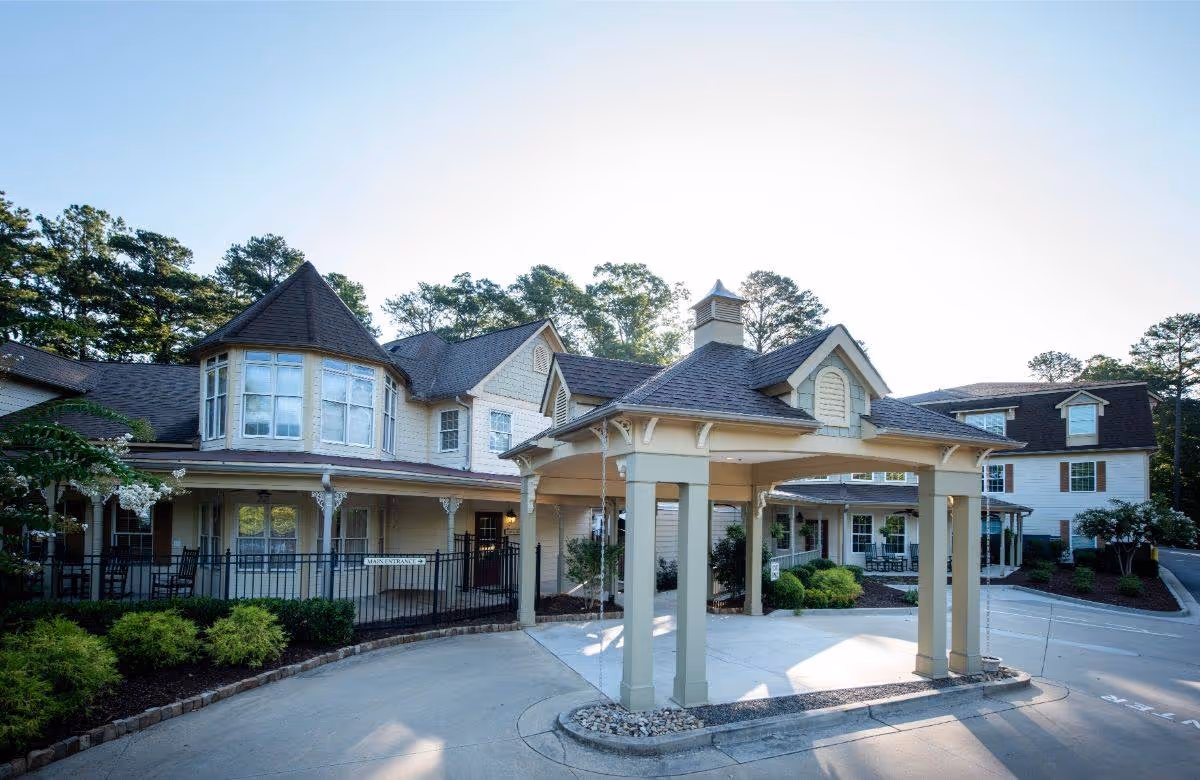 Exterior view of Highlands Senior Living Norcross with a porte-cochère entrance.