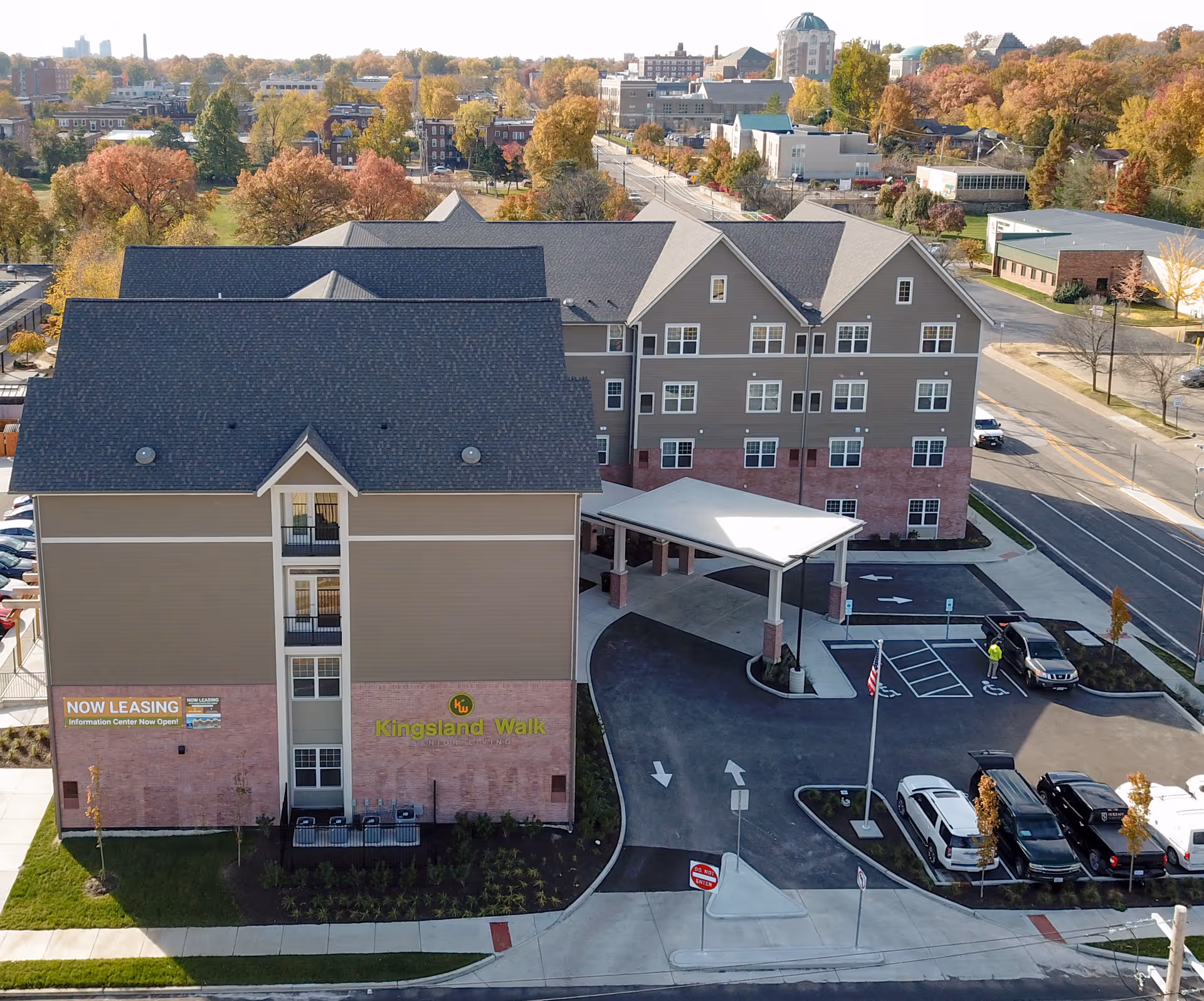 Aerial view of Kingsland Walk Senior Living campus with entrance canopy and parking.