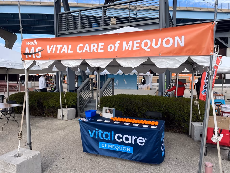 Outdoor event tent for Vital Care of Mequon with a registration table.