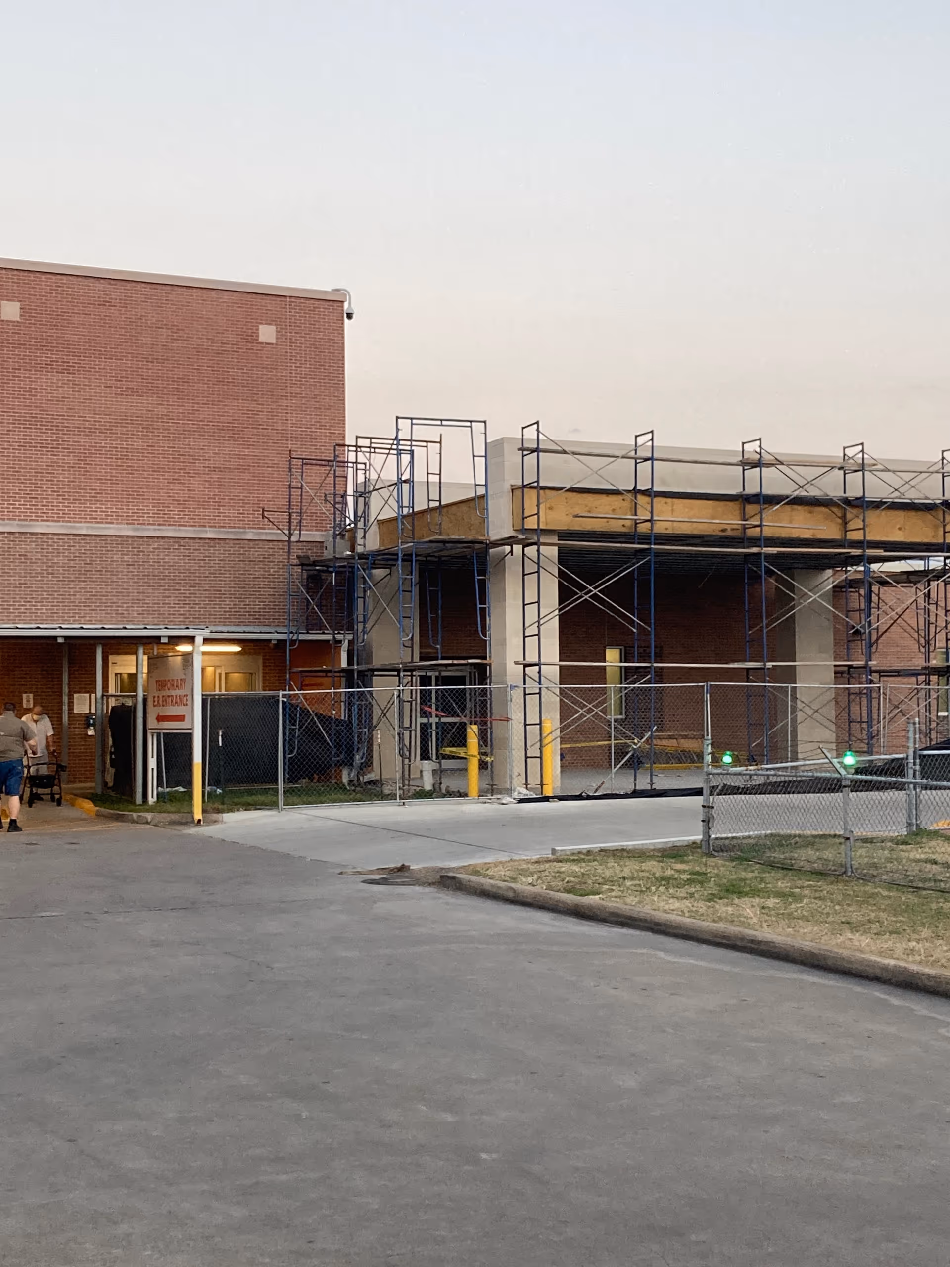 Brick building with front scaffolding; construction underway at Citizens Medical Center entrance.