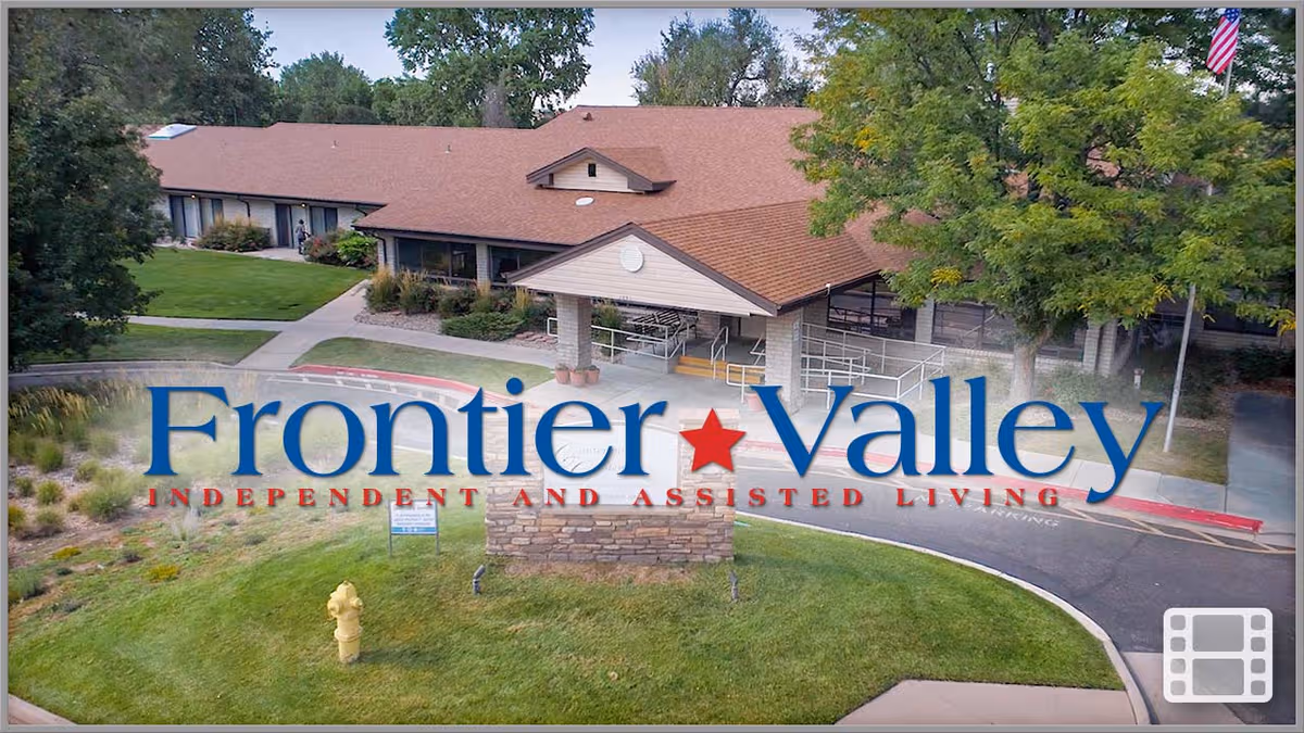 Exterior view of Frontier Valley Independent and Assisted Living with front entrance and landscaped grounds.