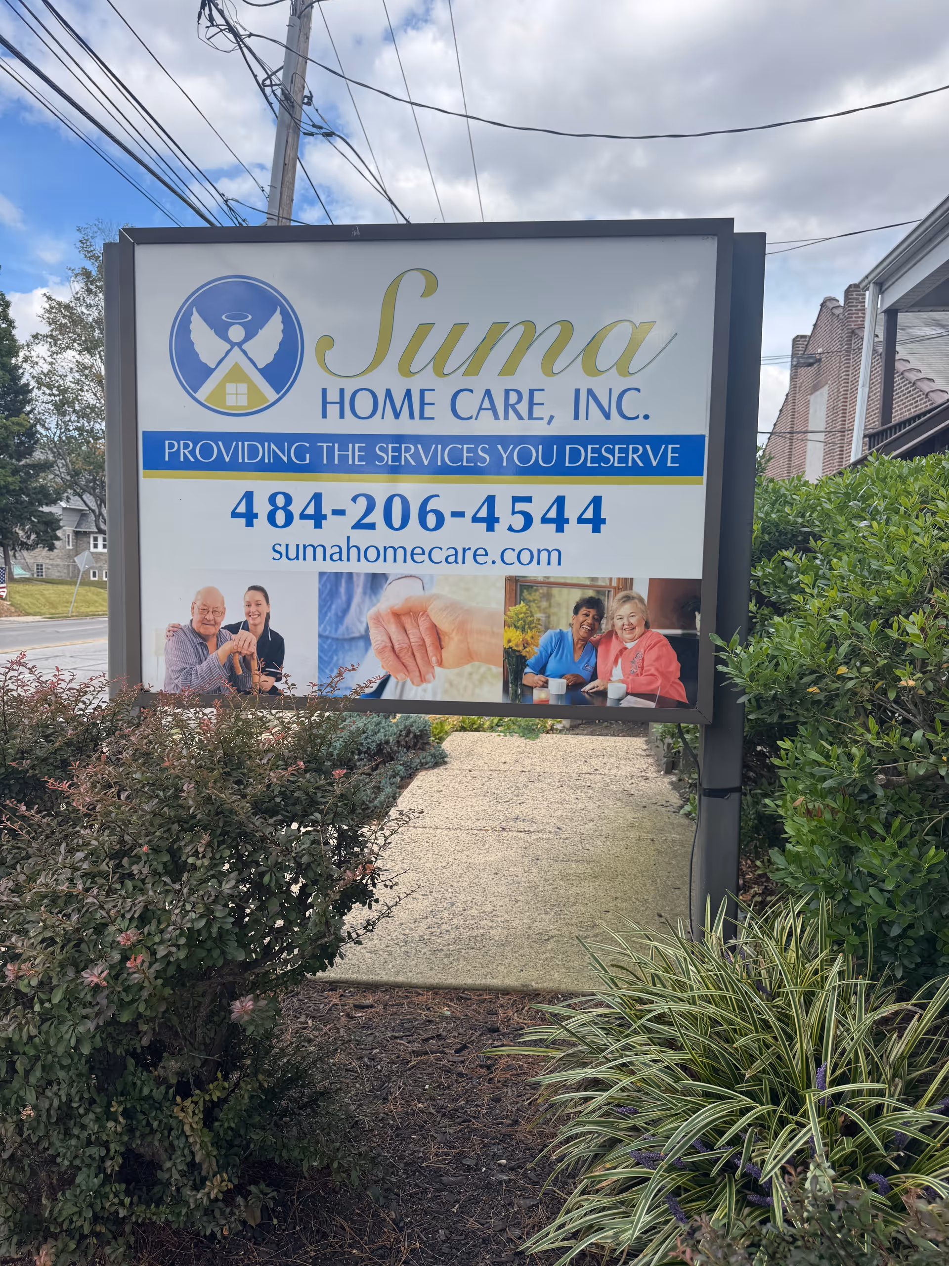 Outdoor sign for Suma Home Care, Inc. with logo and contact information.