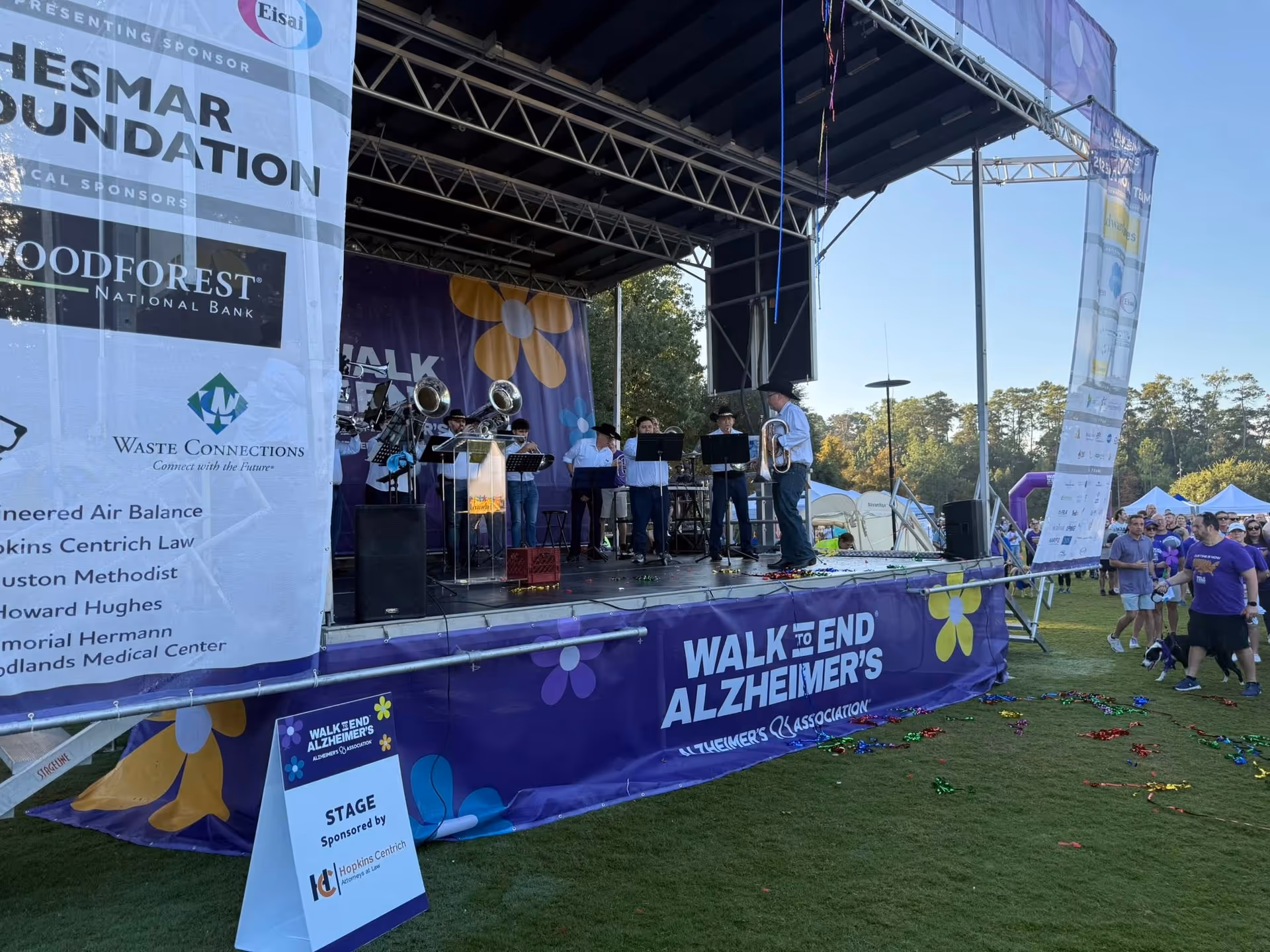 Outdoor stage with a band performing at a Walk to End Alzheimer's event