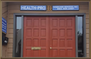 Front entrance with red double doors and Health-Pro sign on the building.