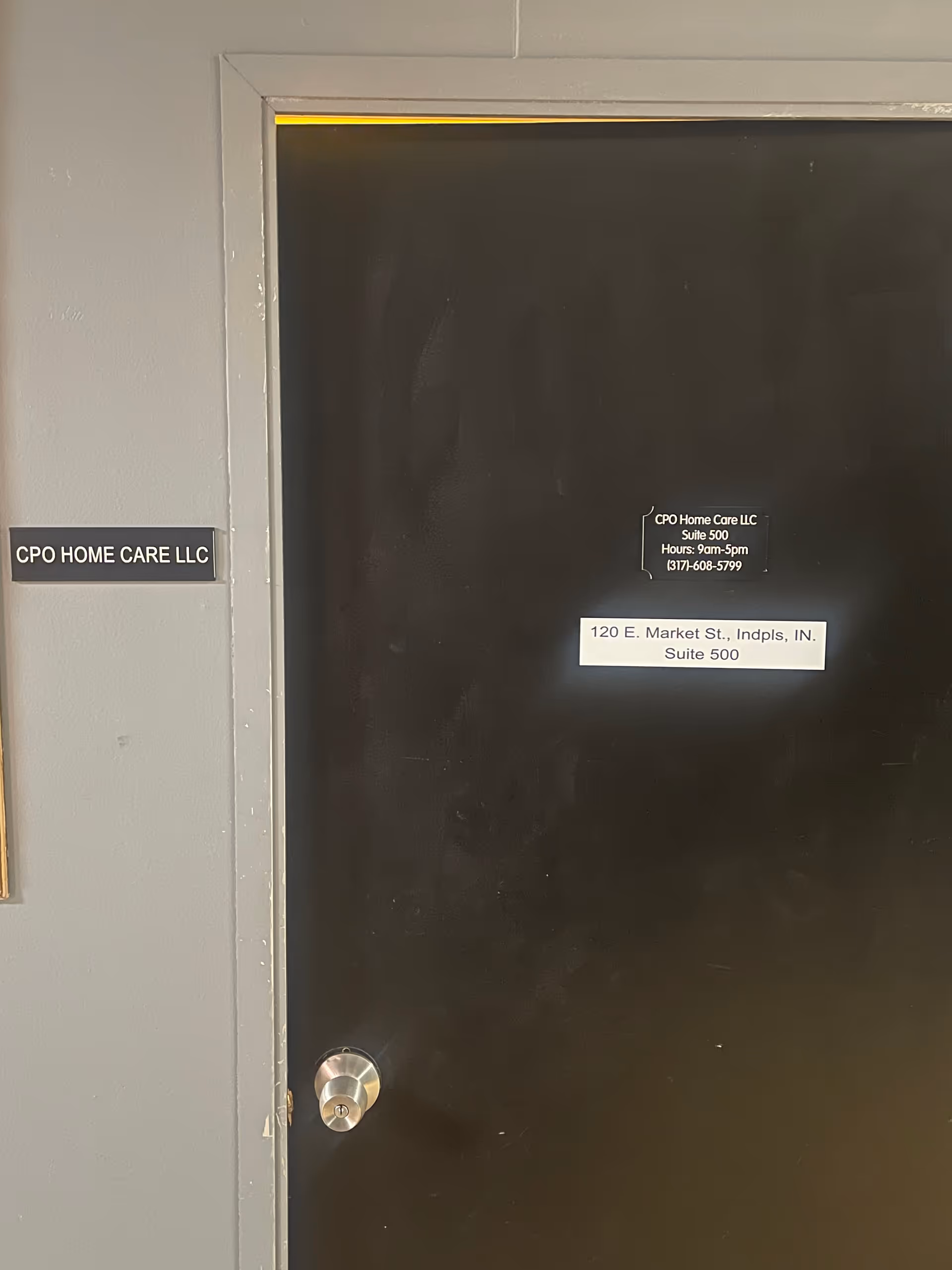 Interior doorway with wall sign and door plaques for CPO Home Care LLC.