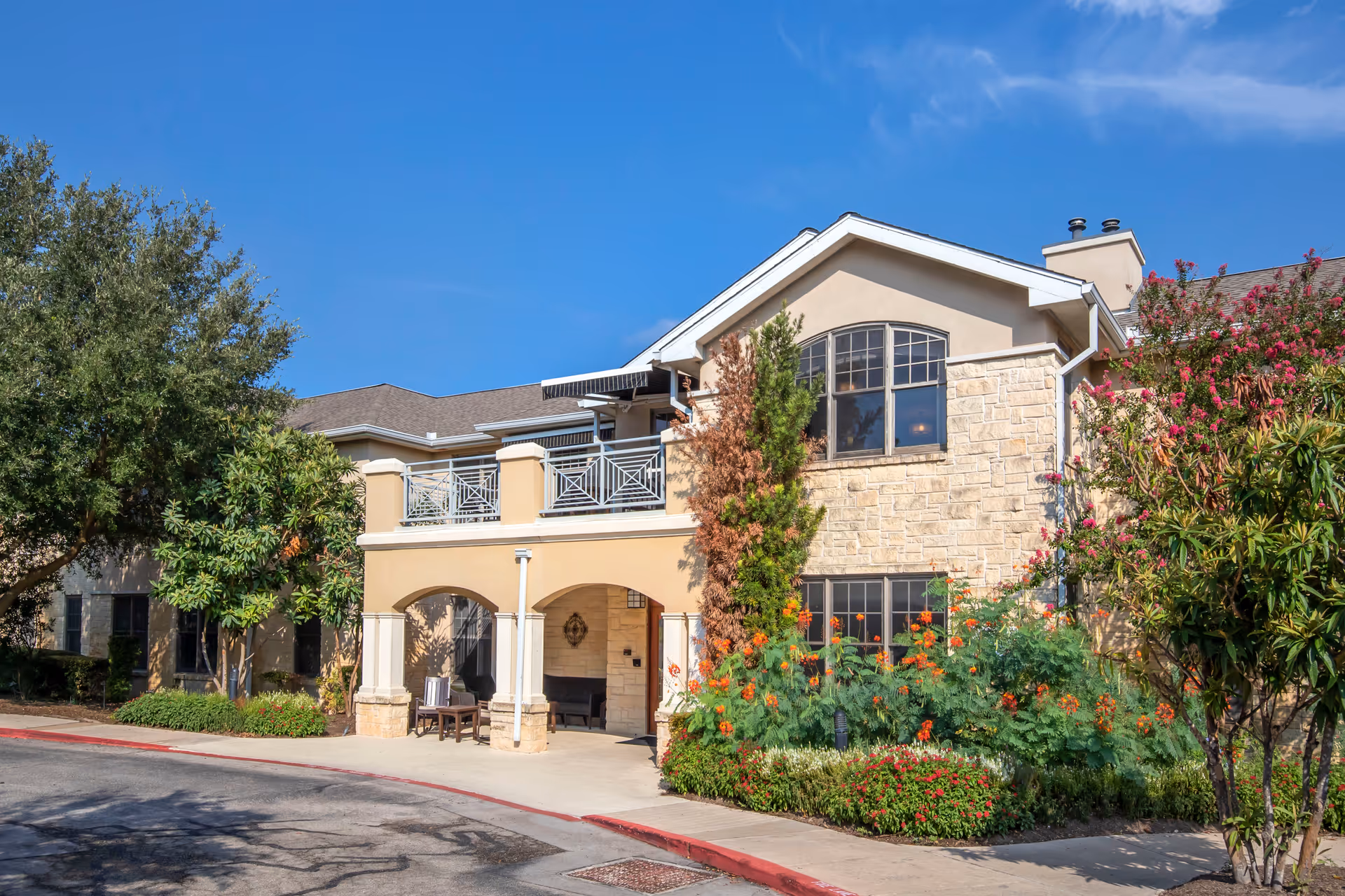 Brookdale Lakeway front exterior of a two-story senior living facility with stone facade.