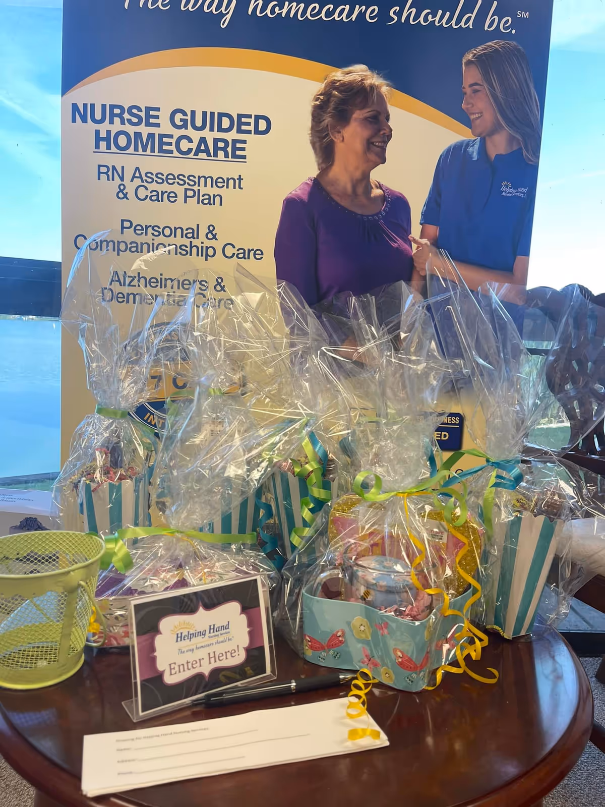 Promotional banner for nurse-guided homecare with gift baskets on a table