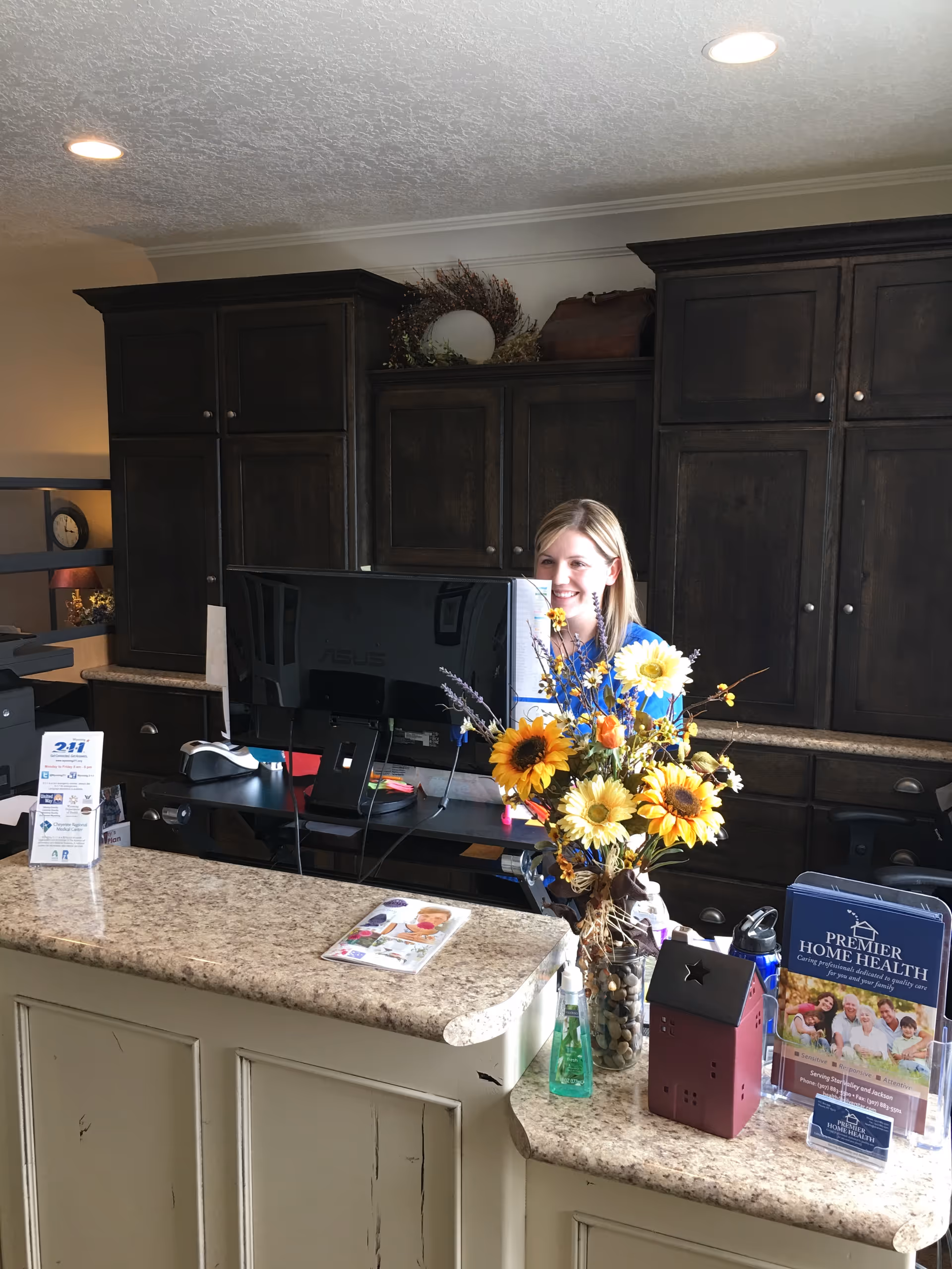 Reception area inside Premier Home Health with a receptionist at the desk.