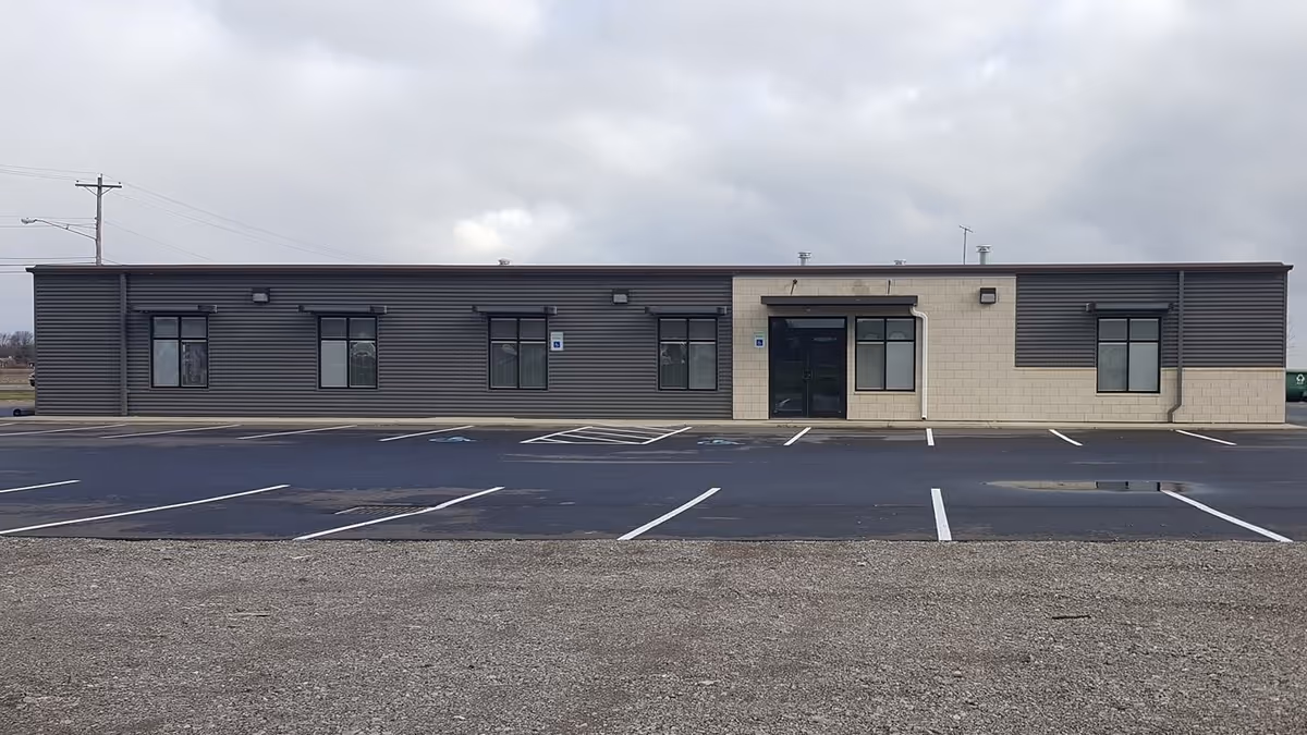 Exterior view of CHP Home Care & Hospice building with a parking lot in front.