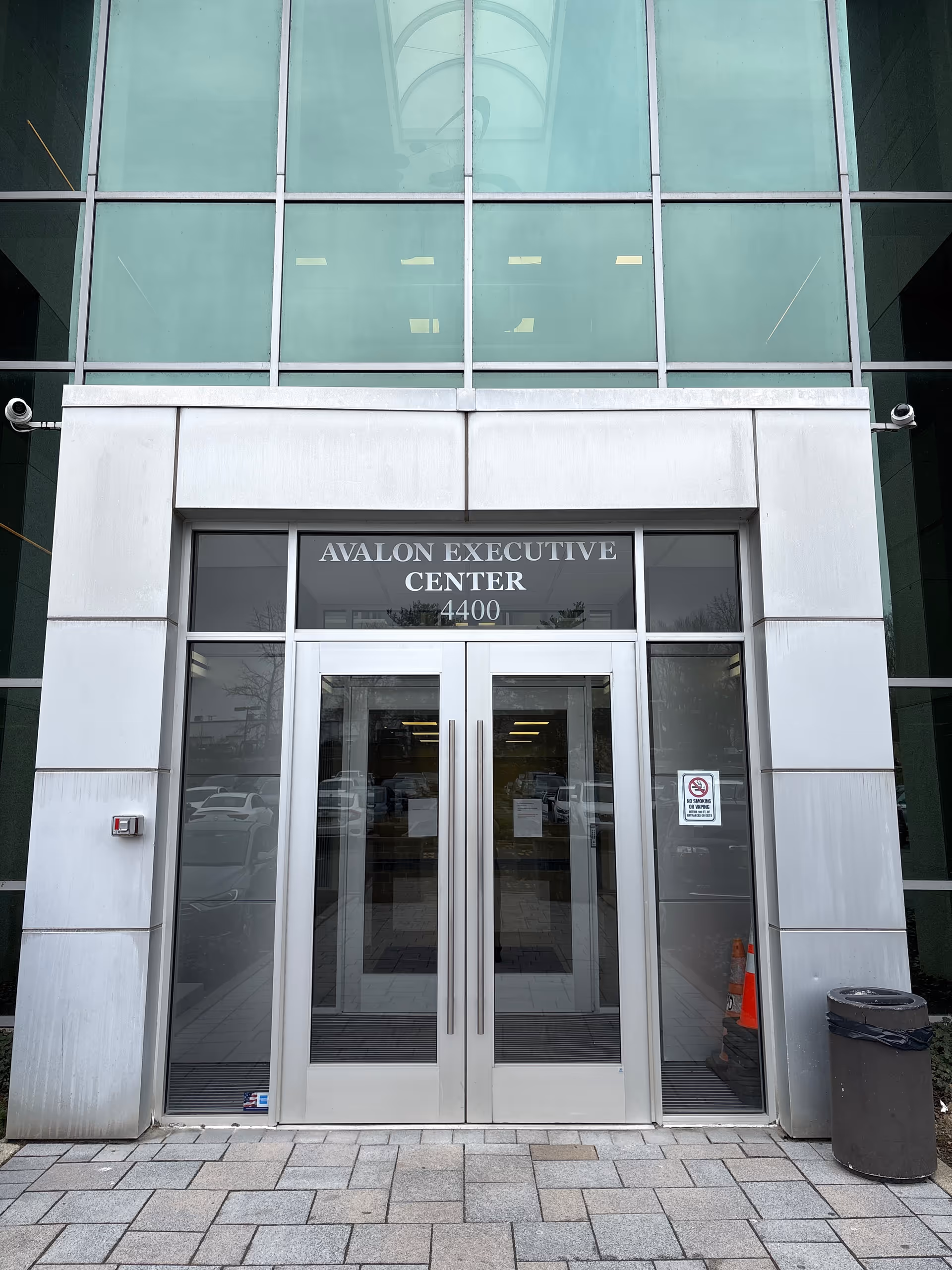Glass-fronted corporate-style entrance with double doors and Avalon Executive Center signage.