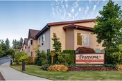 Exterior view of Panorama Senior Living with sign and landscaped entrance.