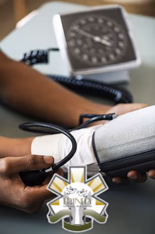 Close-up of a healthcare worker measuring blood pressure with a cuff and stethoscope.