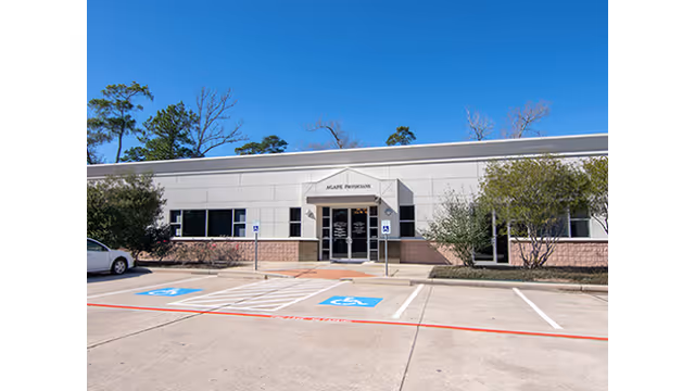 Exterior view of Agape Physicians clinic with accessible parking and glass entry