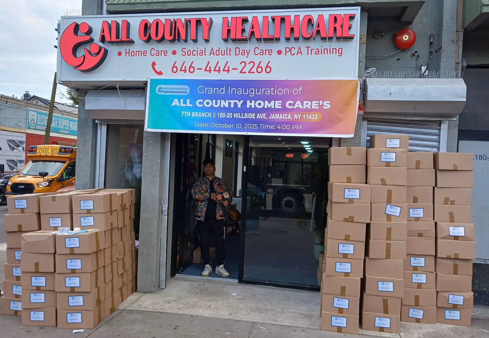 All County Healthcare storefront with stacked boxes and a person at the entrance.