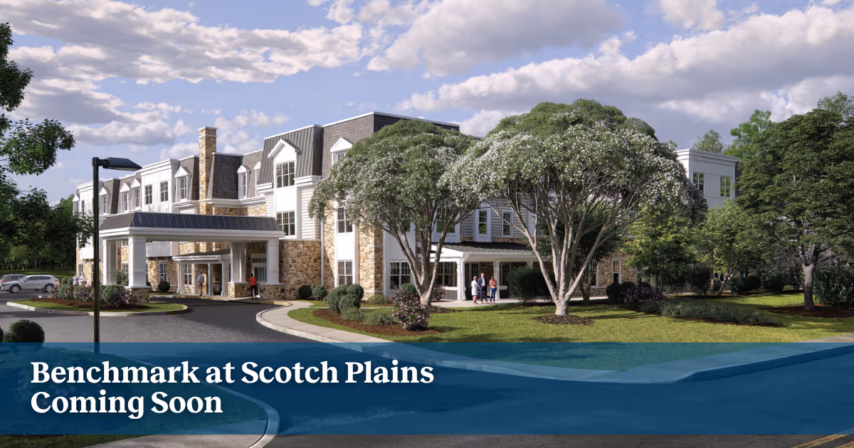 Exterior view of Benchmark at Scotch Plains building with trees and entrance.