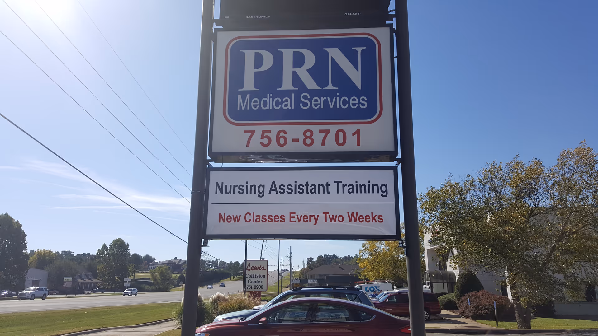 Tall outdoor sign for PRN Medical Services advertising nursing assistant training and classes.