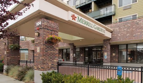 Exterior view of Merrill Gardens at Renton Centre entrance with brick columns.