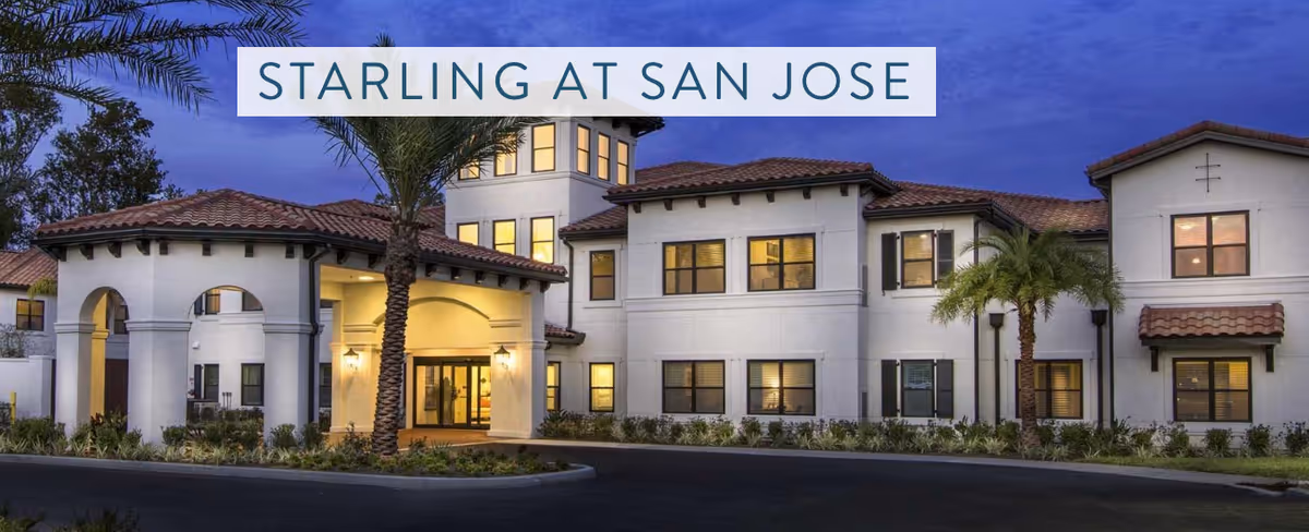 Exterior view of Starling at San Jose with entryway and palm trees.