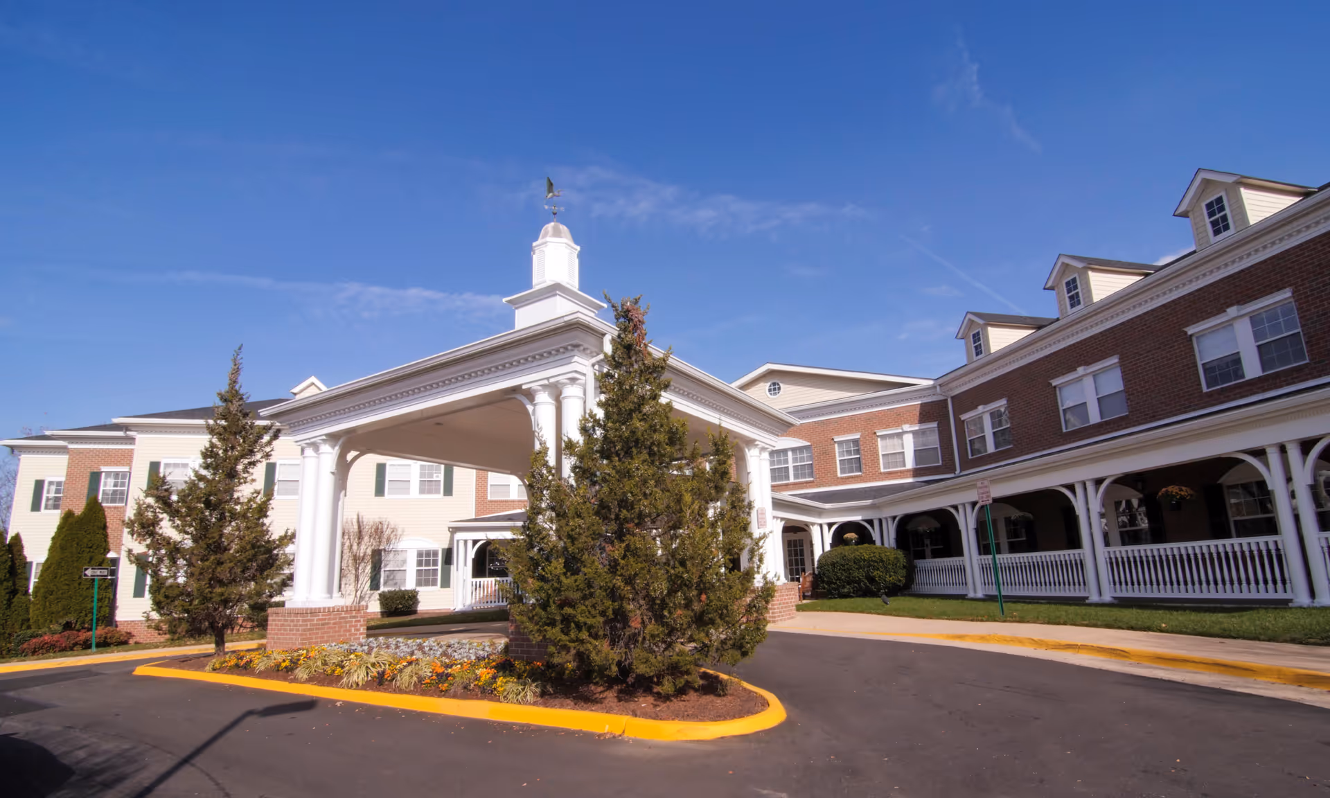 Exterior view of a Brookdale Lake Ridge senior living campus with a white portico entrance.