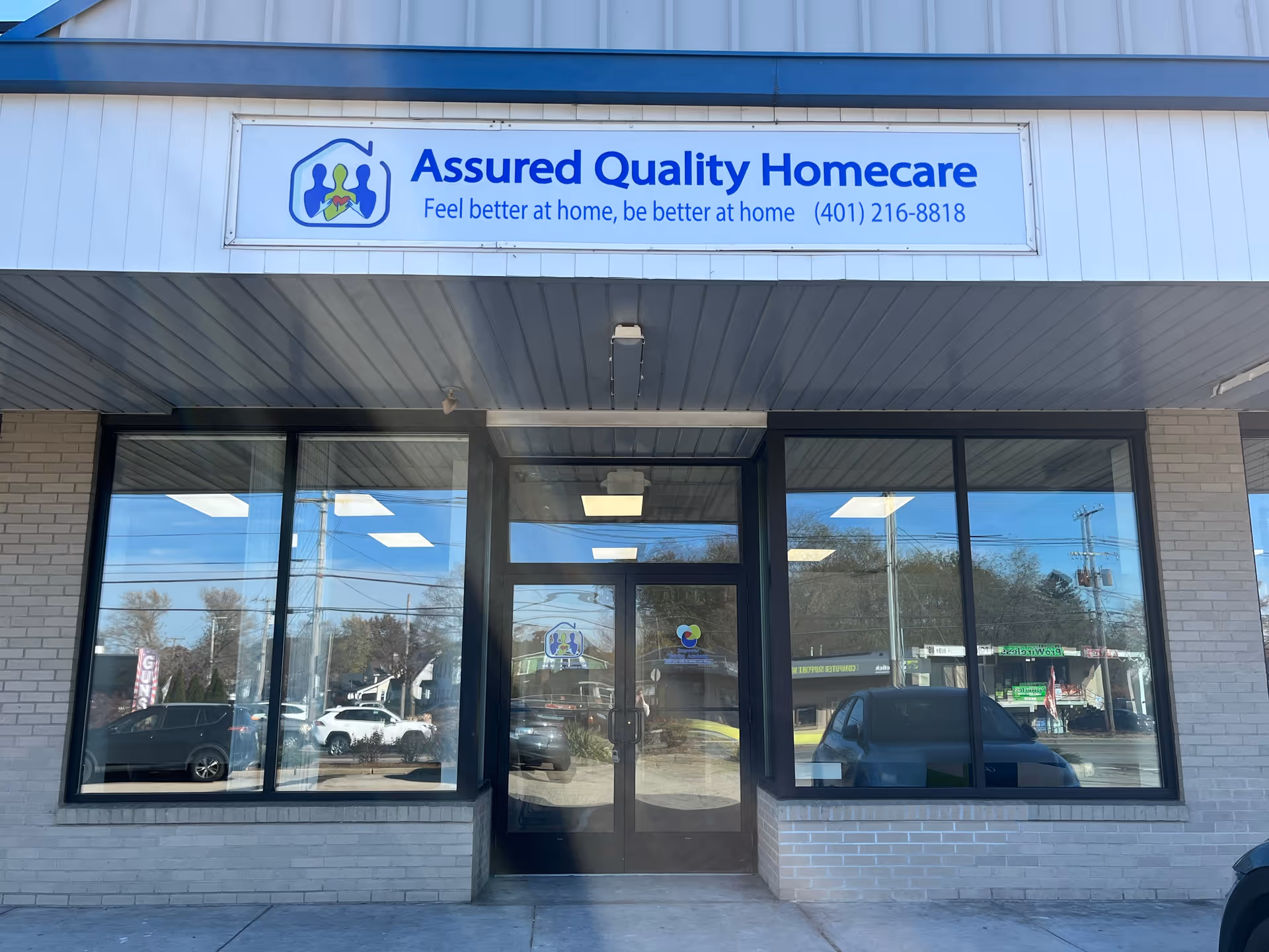 Front view of Assured Quality Homecare storefront with large windows and sign.