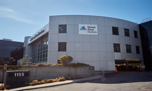Exterior view of Mount Sinai Doctors-Manhasset building with signage and entrance.