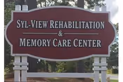 A large outdoor sign reads Syl View Rehabilitation and Memory Care Center.