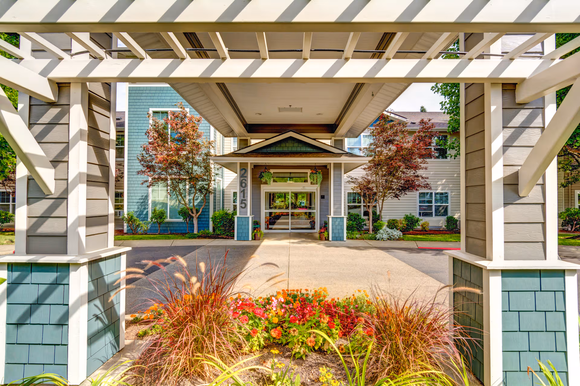 Front entrance of Lone Oak Assisted Living with landscaped path and inviting exterior.