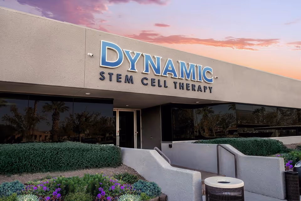 Front exterior of a modern building with a large sign reading Dynamic Stem Cell Therapy.