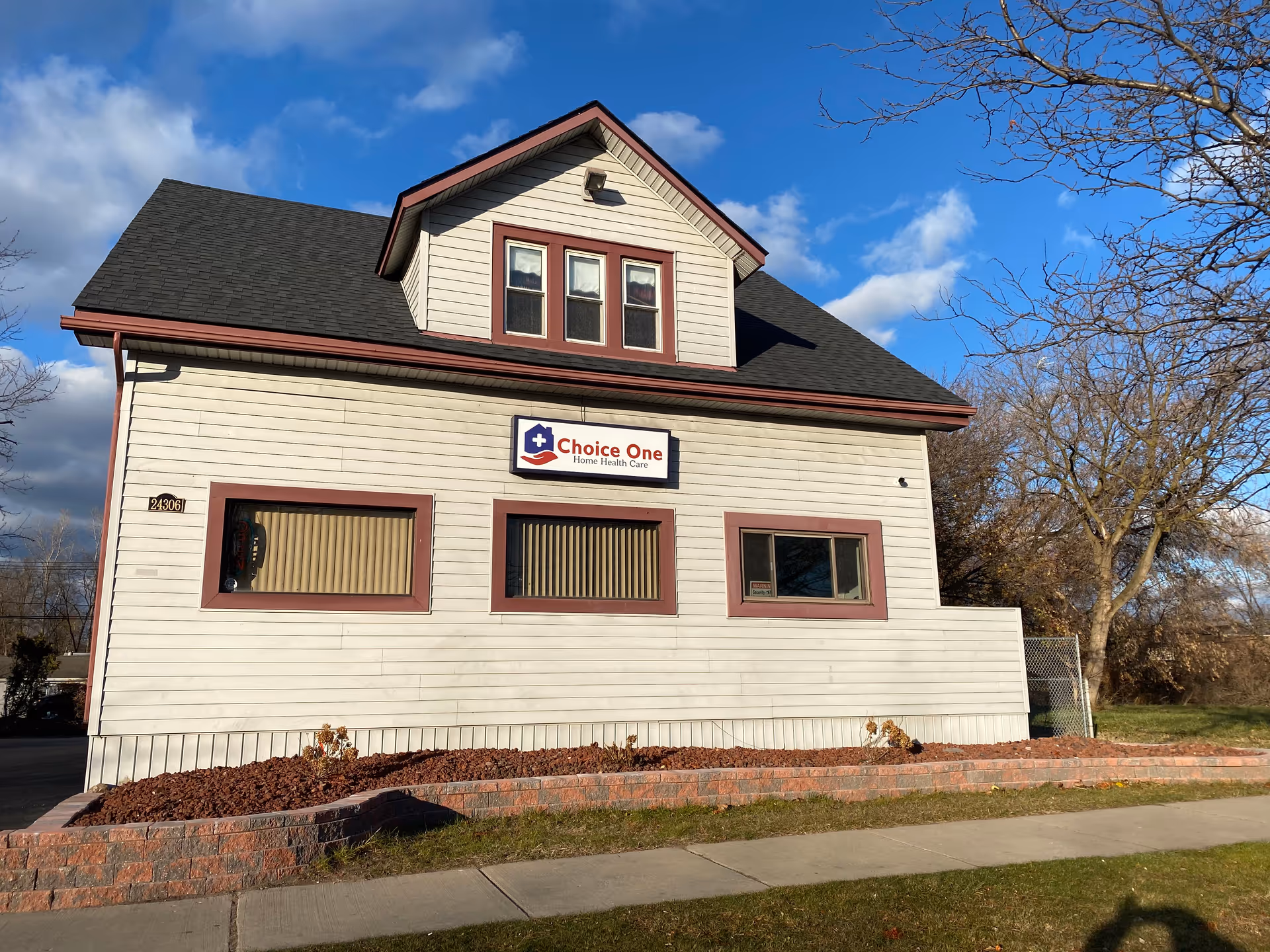 White two-story building with Choice One Home Health Care sign on the front.