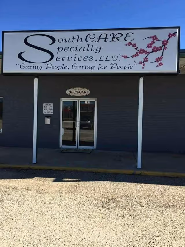 Front view of a building with a large SouthCARE sign and double glass doors.