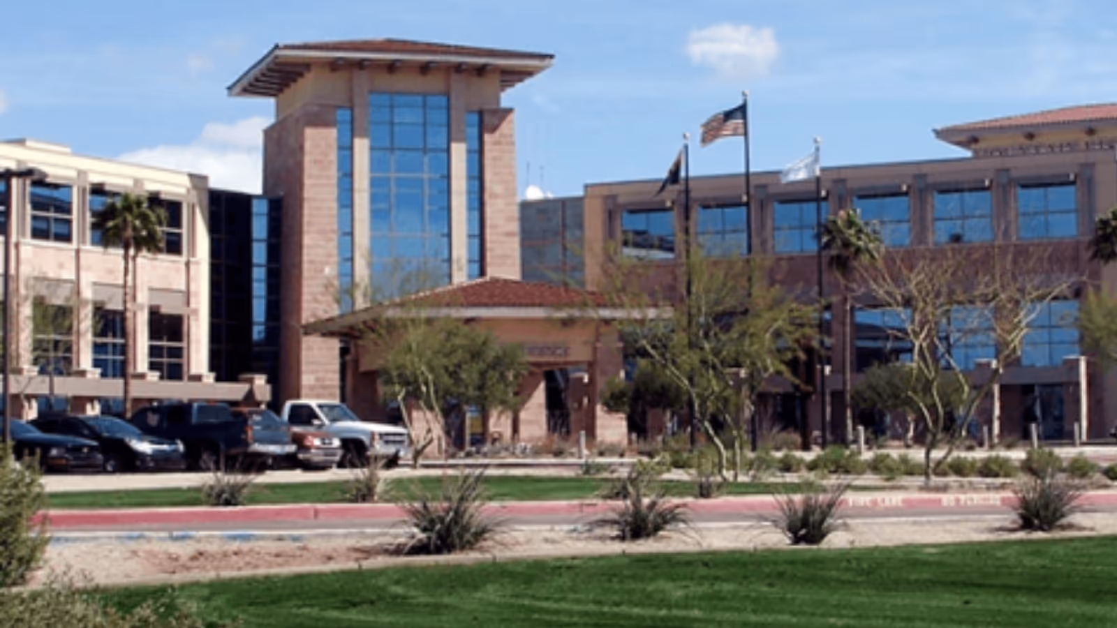 Exterior view of HonorHealth Outpatient Therapy East Mesa, a modern medical facility with parking.