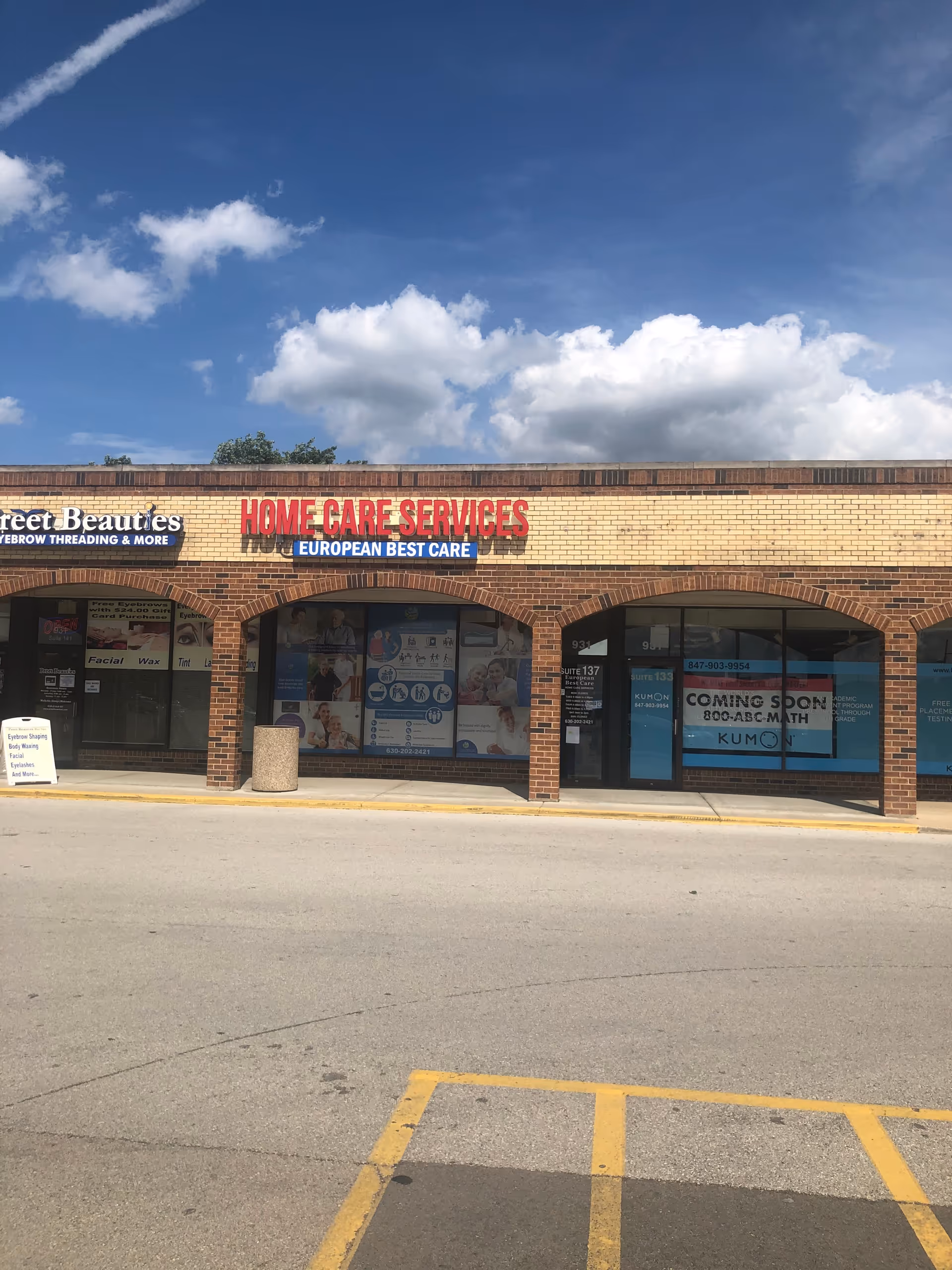 Brick storefront strip mall with Home Care Services European Best Care sign across the front.