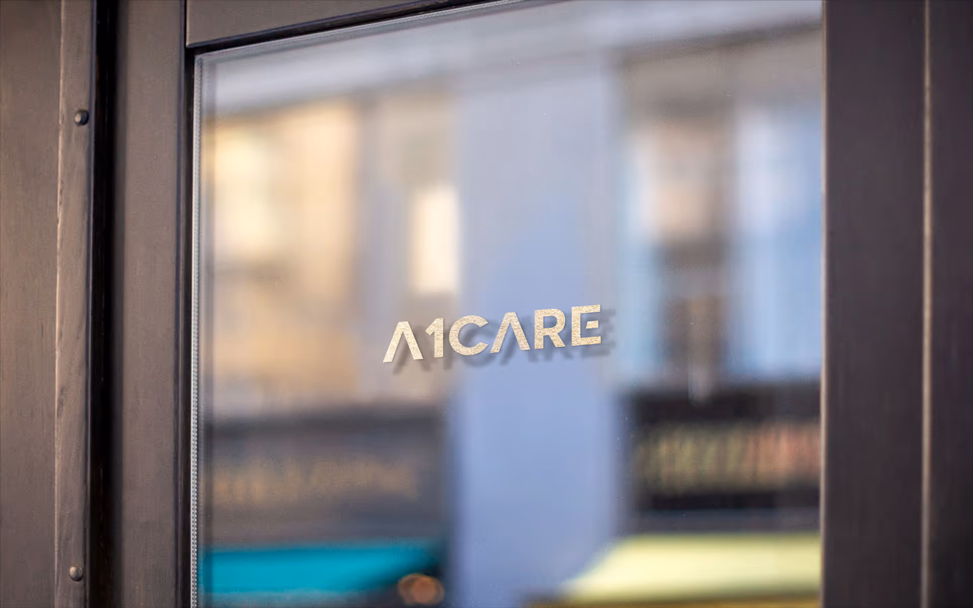 Glass entry door with A1CARE logo, blurred interior visible beyond the entrance.