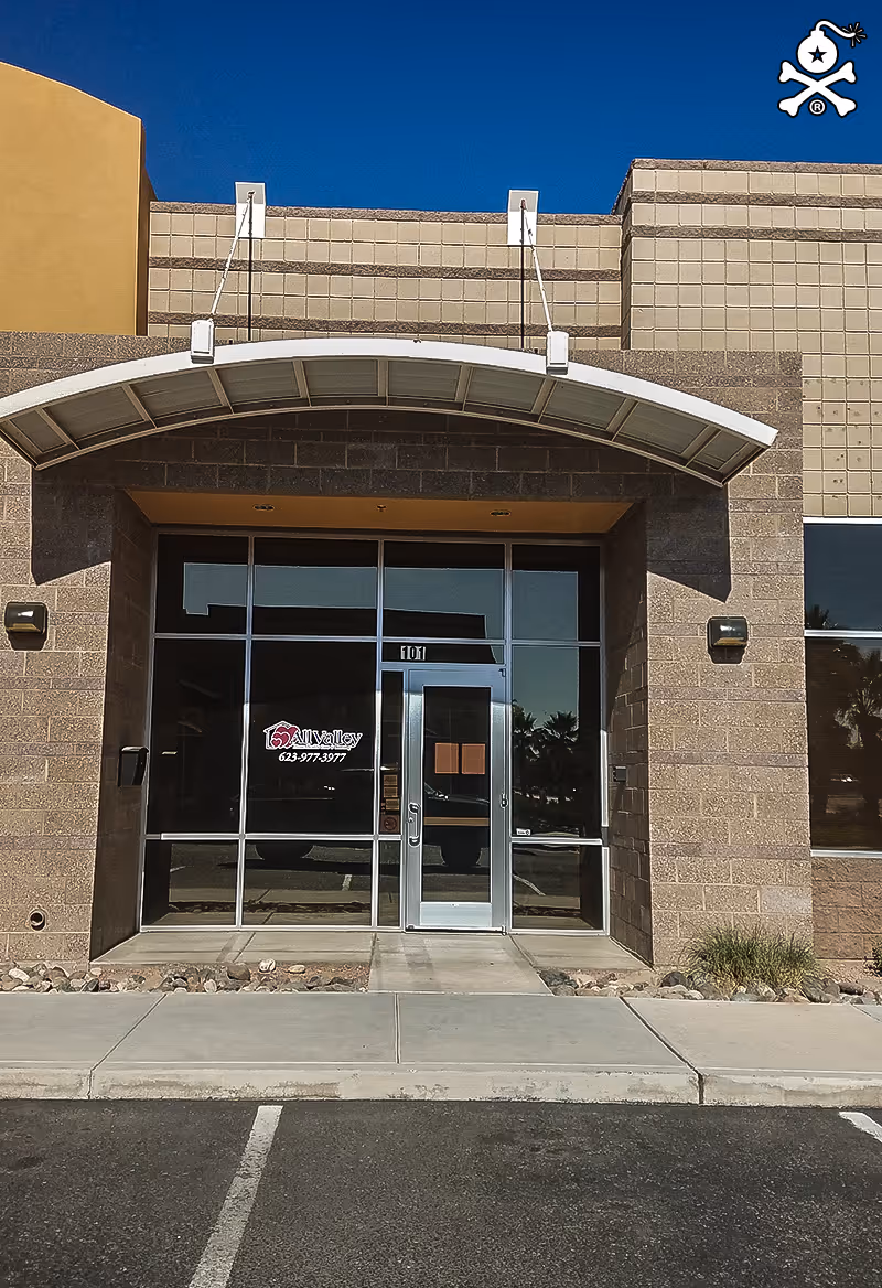 Exterior entrance of All Valley Home Health Care and Nursing with glass doors and a canopy
