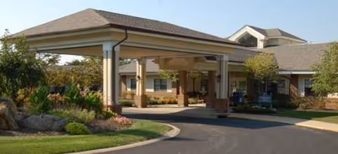 Porte-cochère entrance to Brookdale Westlake Village with landscaped driveway and building facade.