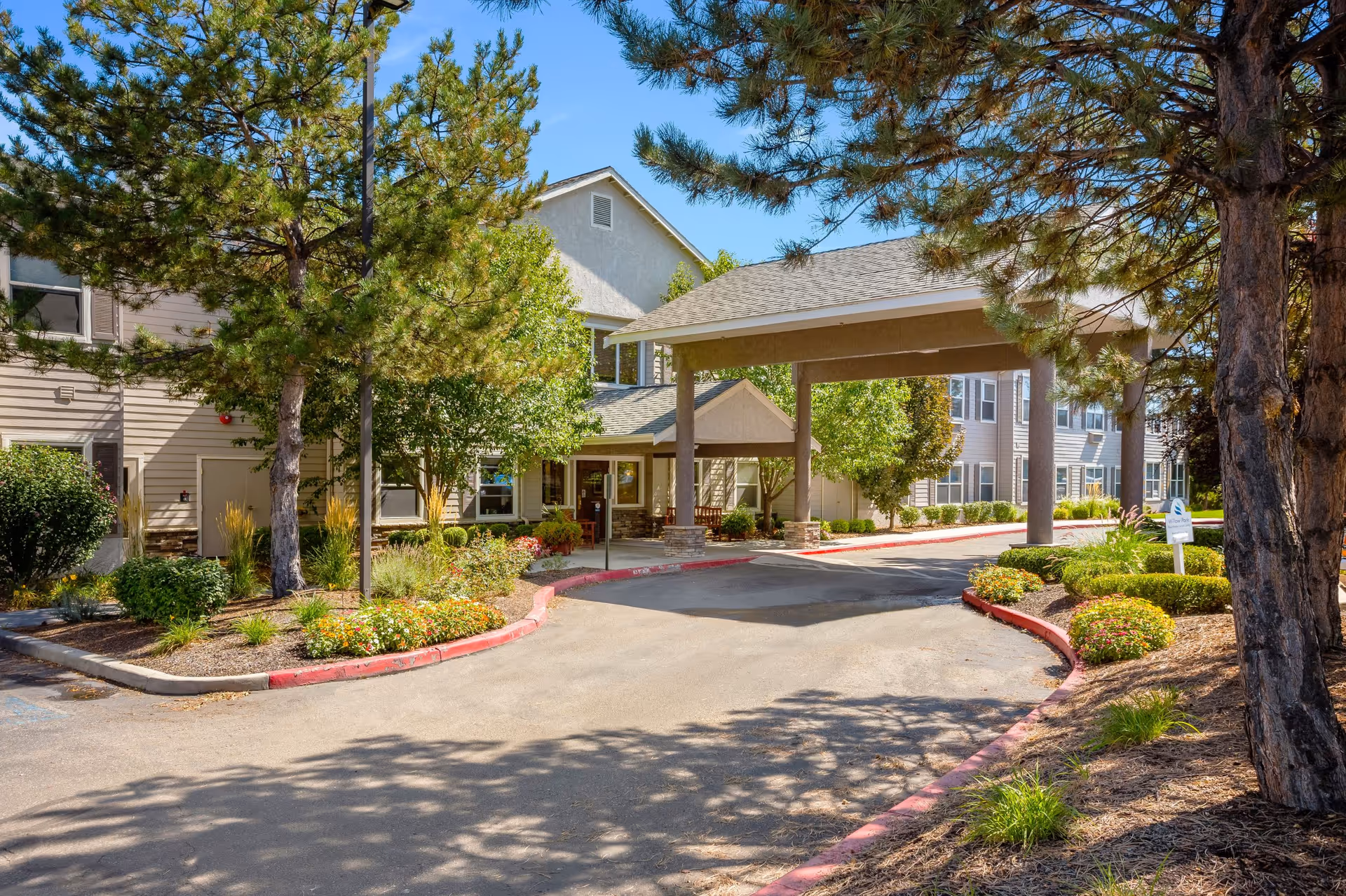 Exterior view of Truewood by Merrill Boise with entrance canopy and landscaped drive.