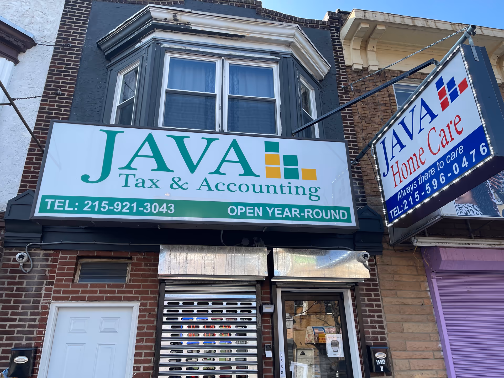 Facade of a storefront with JAVA Home Care and JAVA Tax & Accounting signs.