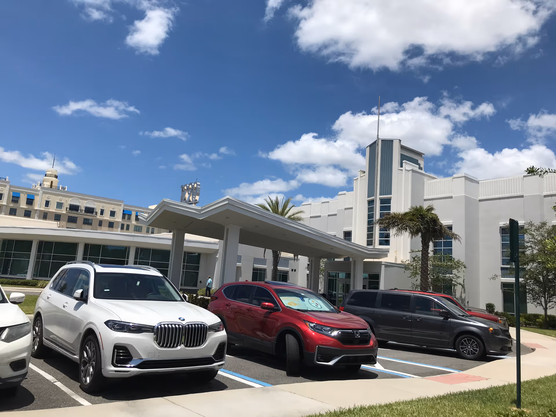 Solaris Healthcare Celebration building exterior with a covered entrance and parked cars.