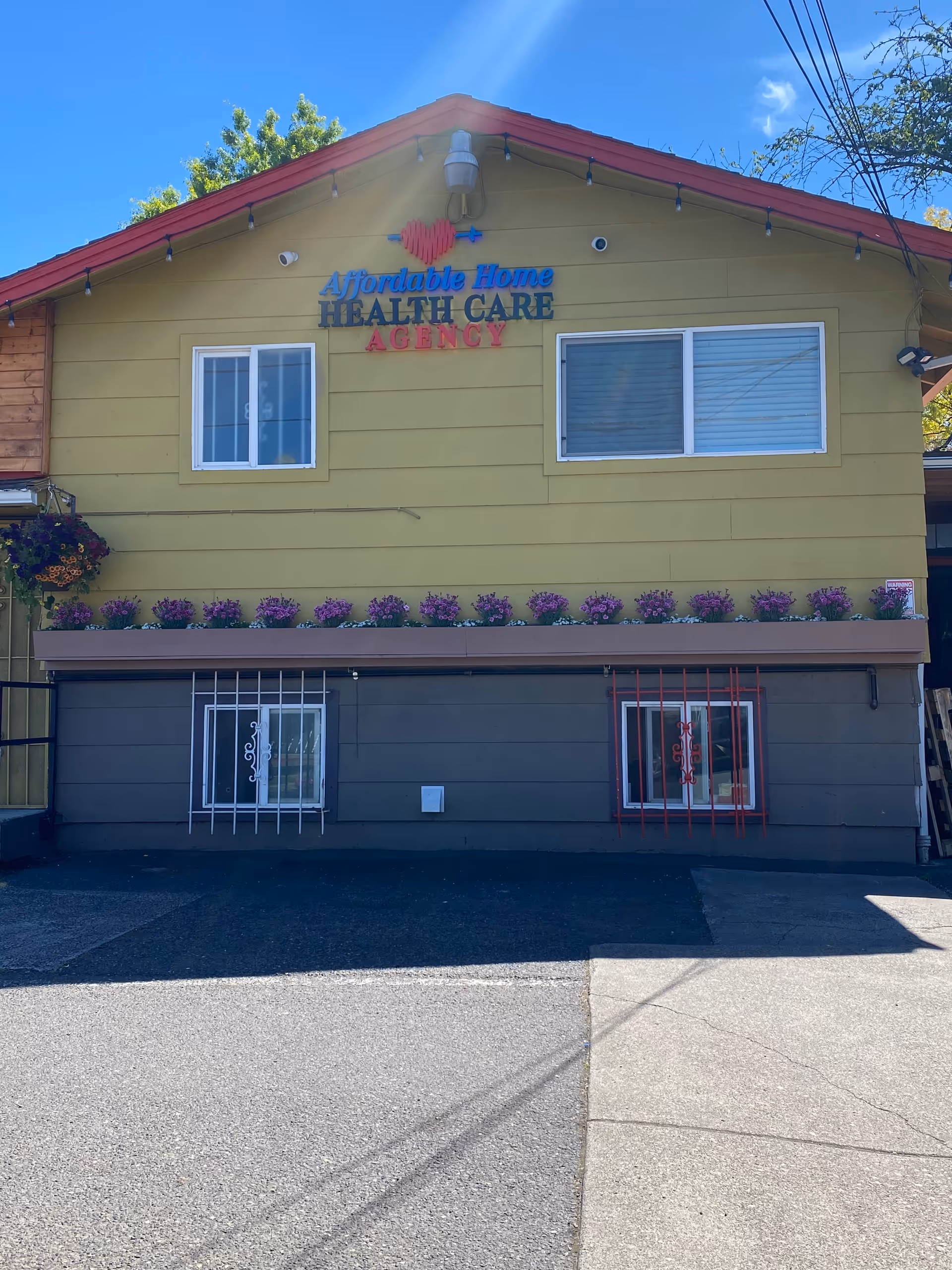 Front view of a yellow building with Affordable Home Health Care Agency sign