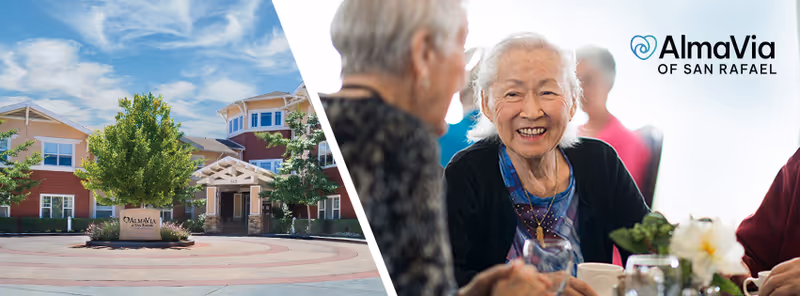 Split image showing the exterior front entrance of AlmaVia of San Rafael on the left, with a circular driveway, trees, and a sign. On the right, elderly people are seated at a table, smiling and engaging in conversation in a bright, social setting.